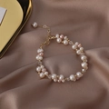 Detail of freshwater pearl bracelet with gold beads and crystal on silk background - 7# Splicing Bracelet