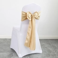White stretch chair cover with a decorative gold satin bow for banquet weddings - Light Champagne