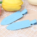 Macro detail of blue matte hair clips for styling on white lace and floral decor - Dark Blue