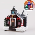 Miniatura di chiesa natalizia luminosa in resina con neve ed effetto luce LED - Grande Stile D