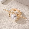 Close-up of golden geometric open ring featuring a large white pearl on a stone surface - Minimalist Geometric Pearl (Gold) (RZ0872-B)