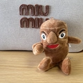 Brown shark plush keychain with red lips and big nose detail on woven bag background - 18cm Stickman