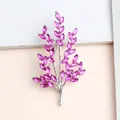 Elegant silver leaf brooch with marquise-cut pink crystals for floral-inspired fashion style - Silver + Purple