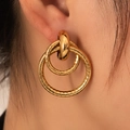 Gold layered hoop earrings featuring textured geometric rings on female model - Gold Triple Link Lattice Hoop (BJGE0729)