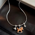 Saturn necklace with zircon wood rocking horse and silver heart charms on snake chain - Zirconia Inlaid Wooden Rocking Horse Saturn Heart Necklace