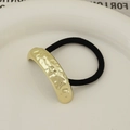 Minimalist black elastic hair tie featuring a hammered gold metal finish decorative piece - Single Layer Pleated Gold