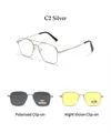 Close-up of magnetic clip-on system with dark gray polarized and yellow night vision lenses - Silver