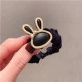 Elastic black scrunchie featuring a cute cartoon bunny charm with white accent ears - Black Rabbit Cartoon Scrunchie 1Pc