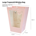 Pink trapezoid gift bag with clear window, white rope handles and decorative tag - Large Trapezoidal Pink