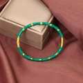 Macro detail of green enamel bamboo bracelet with gold-plated stainless steel clasp - Green