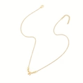 Minimalist gold necklace featuring a letter W pendant accented with small beads - Letter W