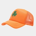 Detail of breathable orange mesh trucker hat featuring a green clover pattern - Solid Fluorescent Orange
