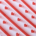 Christmas tissue paper with red diagonal stripes and heart patterns on white background - Diagonal Stripe Hearts