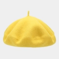 Detail of a bright yellow wool beret featuring thick felt texture and classic top stem - One Size / Bright Yellow