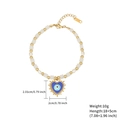 Bracciale di perle con sfere dorate e ciondolo a forma di cuore malocchio blu - Bianco Trasparente/Cuore Blu