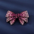 Elegant bow hair clip featuring sparkling pink and rose rhinestones on black alloy base - Pink