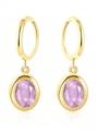 Detailed macro view of vintage oval lavender zircon pendants on gold hoops for women - Purple