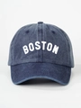 Detailed close-up of dark blue washed denim baseball cap featuring white BOSTON print - Adjustable / Navy Blue
