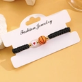 Bracciale intrecciato regolabile con perla basket arancione e ciondolo a cuore - 02 KC Oro Stile Basket