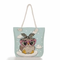 Detailed view of canvas tote bag featuring cute cartoon owl print and rope handles - Heart Glasses Owl on Cloud