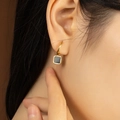 Elegant gold hoop earrings with square black charms shown on model in a soft warm setting - Gold Hoop Black Square Pendant Earrings (E793-GO)