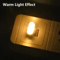Compact USB warm yellow LED night light plugged into socket for cozy atmosphere - Warm White