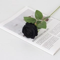 Single black velvet artificial rose with green leaves on magazine for home decor - Small Velvet Black