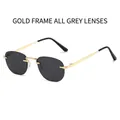 Lunettes de soleil ovales en métal doré avec verres gris au style moderne - Monture Dorée Verres Gris