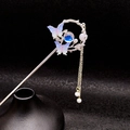 Horquilla de mariposa vintage con cuenta azul y detalles púrpuras sobre fondo negro - Azul