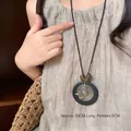 Bohemian beaded long necklace with 6cm black round pendant and vintage brass detailing - Coffee Round Straw Hat Star Style