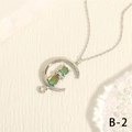 Detailed view of crescent moon and cat necklace featuring iridescent green stones - Silver Gradient Green Cat Moon (NE2147-B-2)