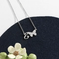 Silver stainless steel butterfly necklace with cursive letter E pendant on blue velvet - Silver E