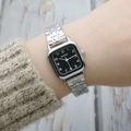 Elegant square silver stainless steel watch with black dial on a knitted sweater cuff - Black