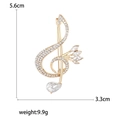 Spilla a nota musicale dorata con strass trasparenti e un grande pendente a goccia - Chiave di Violino/Strass Chiaro / Oro
