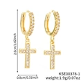 Detail of gold cross earrings with zircon pavé showing exact 2.6cm dimensions and weight - Gold