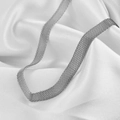 Macro view of silver woven metal mesh chain texture on soft white silk fabric - Steel