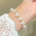 Close-up of Baroque pearl bracelet with gold beads on wrist for women fashion - Gold Baroque Pearl Bracelet (0622)