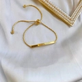 Bracelet ajustable en acier titane doré avec barre métallique gravée Lover Dream chic - Doré