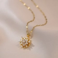 Elegant gold titanium spinning flower necklace with shimmering white zircon stones - X1967 Rotating Snowflake