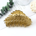 Elegant amber leaf-shaped hair claw clip with a matte finish for bun hairstyles - Jelly Amber