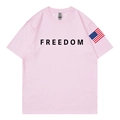 Pink crew neck cotton t-shirt featuring black FREEDOM text and US flag sleeve print - S / Pink