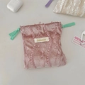 Detailed view of pink velvet drawstring pouch with lace trim and contrasting green cord - Green Drawstring / Pink