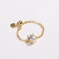 Detailed view of adjustable gold-plated chain ring with oval white cubic zirconia and heart charm - White Zirconia - Gold Plated