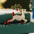 Sparkling reindeer Christmas brooch with white rhinestones and green enamel antlers - Christmas Reindeer