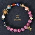 Macro detail of Gemini zodiac bracelet with 8mm natural stones and gold star charms - Gemini