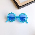 Blue daisy round frame sunglasses for kids with cute floral pattern on white background - Blue