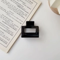 Detail of a minimalist glossy black rectangular hair claw clip on a white background - Glossy Black