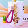 Detail of purple braided rope zodiac snake keychain with gold-plated rhinestone charm - Dark Purple Lucky Rope + Purple Snake