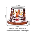 Rotating whiskey glass with face design and wooden base in 150ml capacity - Face Pattern Color Block Tumbler Glass With Wood Base