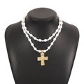 Detailed view of a double-layered pearl necklace with a textured golden cross pendant - Double Layer Pearl Cross Style / Gold